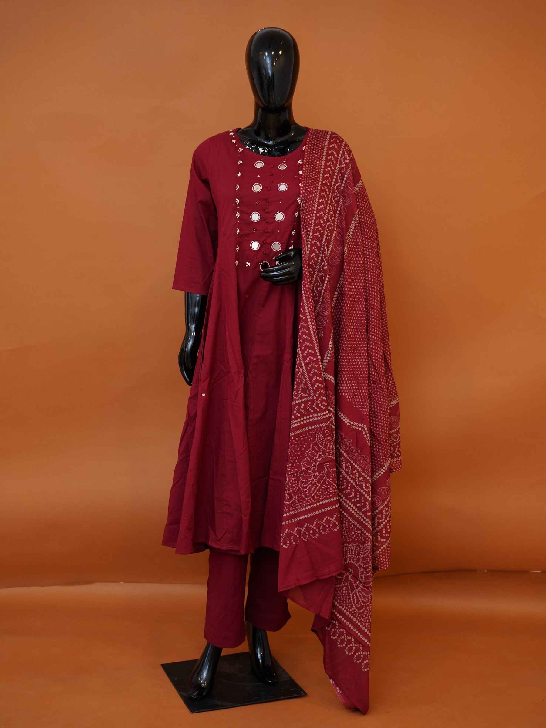 Women's festive maroon cotton suit set with mirror work yoke and Bandhani dupatta available in sizes M to XXL