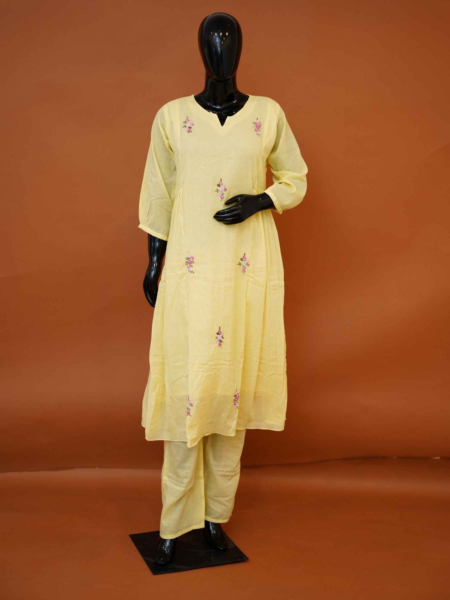 Women's embroidered pastel yellow mulmul cotton tunic set with matching pants available in sizes M to XXL