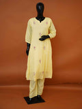 Women's embroidered pastel yellow mulmul cotton tunic set with matching pants available in sizes M to XXL