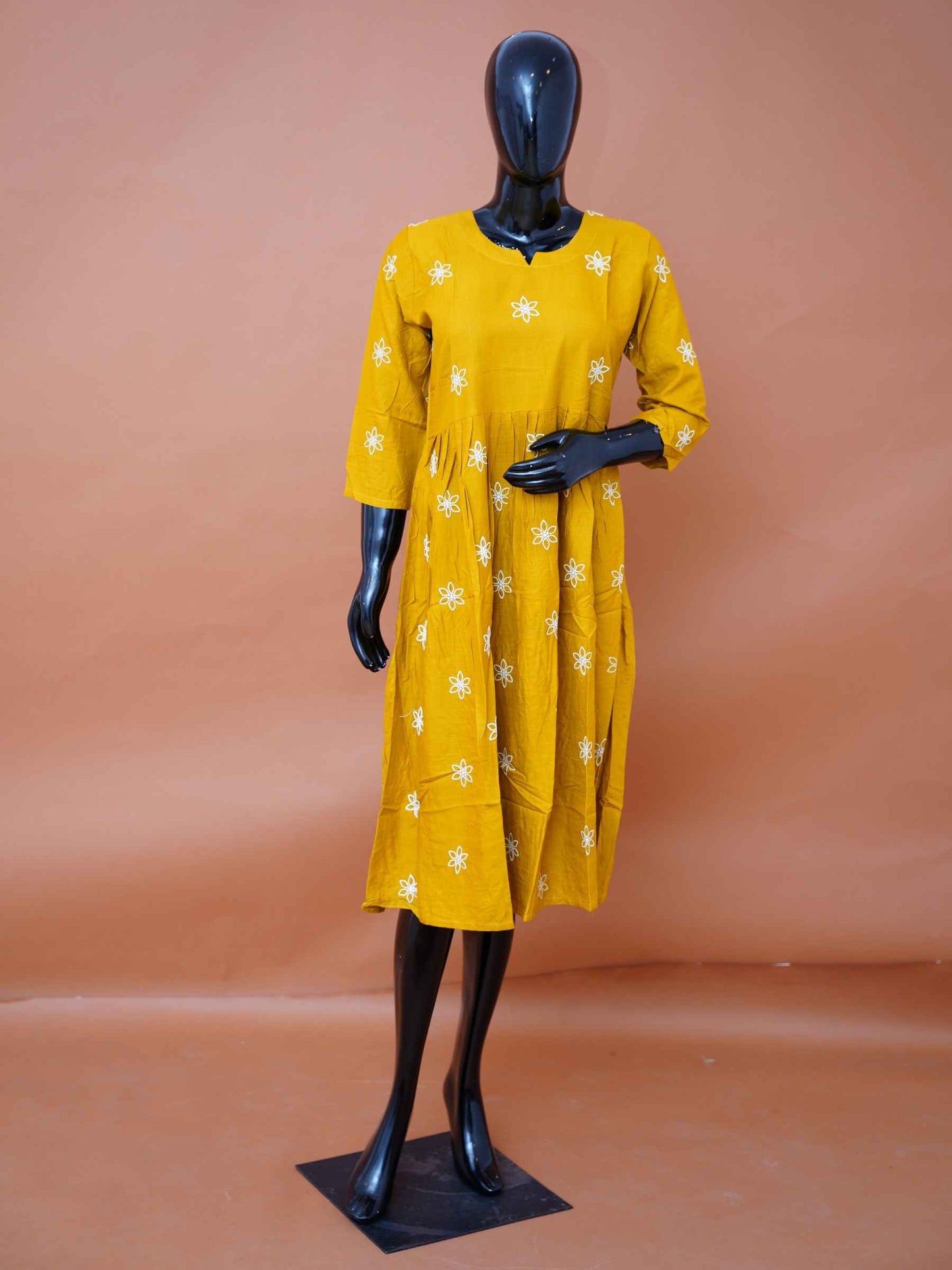 Mustard yellow crepe silk flared kurti top with white floral thread embroidery